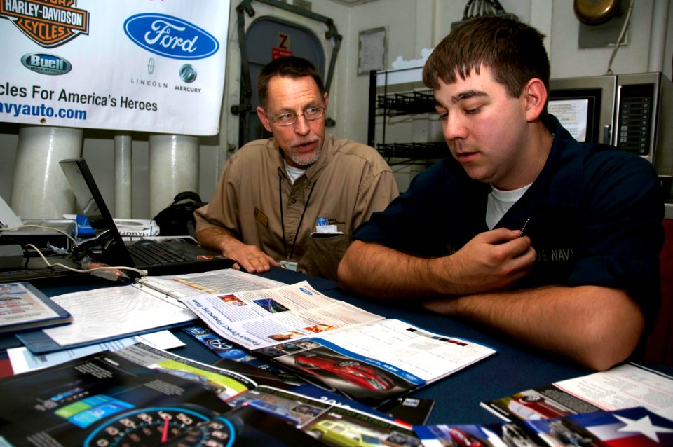 US Navy 100224-N-8936G-008 Seaman Donald Smith speaks with George Franz about car buying