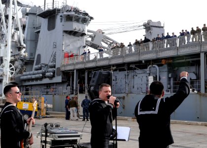 US Navy 100222-N-6676S-140 The Commander, U.S. Naval Forces Europe rock band, The Flagship, perform for the crew of the amphibious dock landing ship USS Gunston Hall (LSD 44) as the ship arrives at Naval Station Rota for a port