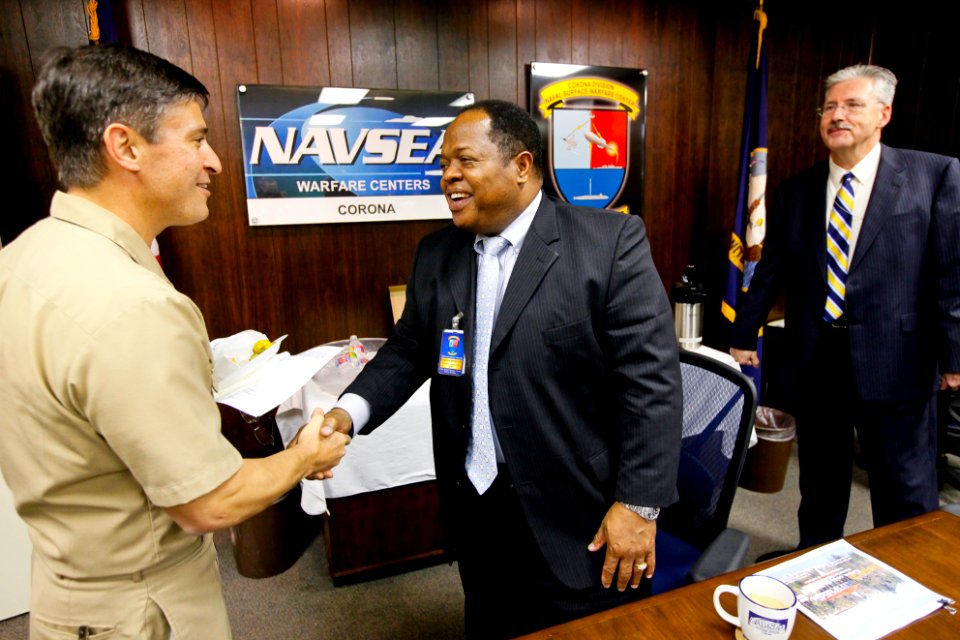 US Navy 100225-N-8863V-299 Capt. Jay Kadowaki, left, commanding officer of the Corona Division of Naval Surface Warfare Center (NSWC), and Dr. William Luebke, right, technical director for NSWC Corona, welcome Deputy Secretary