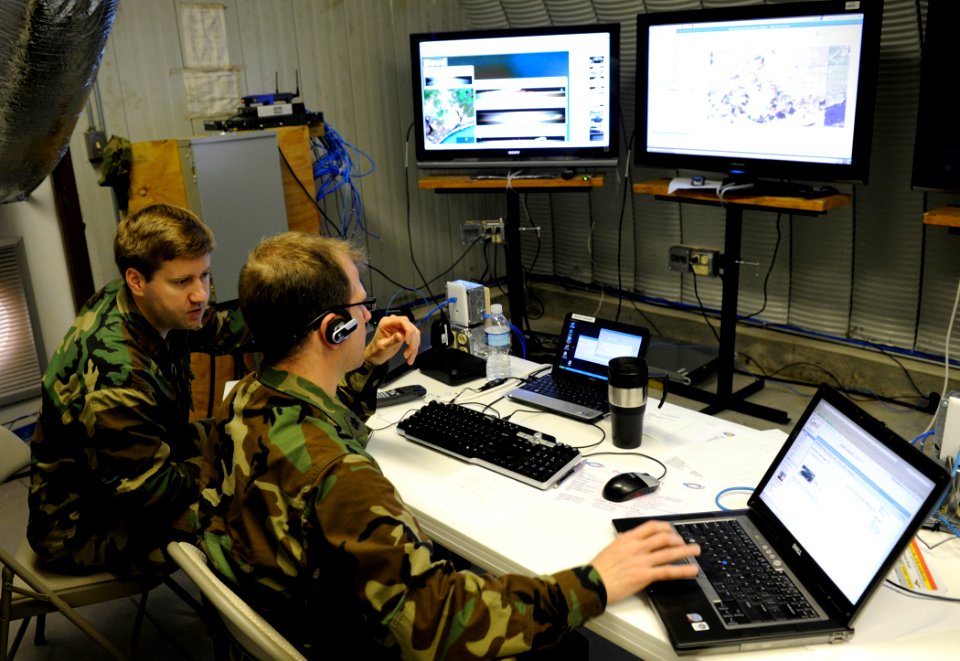 US Navy 100223-N-7676W-040 Lcdr. Ryan Smits, left, and Cdr. Jeff Smith conduct a development test for the Operational Adaptation Integrated Technology Demonstration at Bogue Field, Marine Corps Auxiliary Landing Field