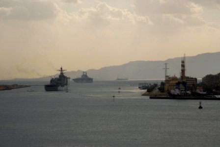 US Navy 100226-N-3358S-228 USS Nassau (LHA 4) is followed by USS Ashland (LPD 48) as they cruise out of the final stretch of the Suez Canal
