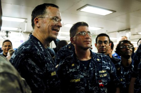 US Navy 100226-N-4995K-136 Chairman of the Joint Chiefs of Staff Adm. Mike Mullen speaks with Lt. Cmdr. Anthony Mortimer and other Sailors aboard the Military Sealift Command hospital ship USNS Comfort (T-AH 20)