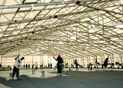 US Navy 100224-N-6003P-247 Contractors apply a non-skid coating on the flight deck of the Nimitz-class aircraft carrier USS Harry S. Truman (CVN 75)