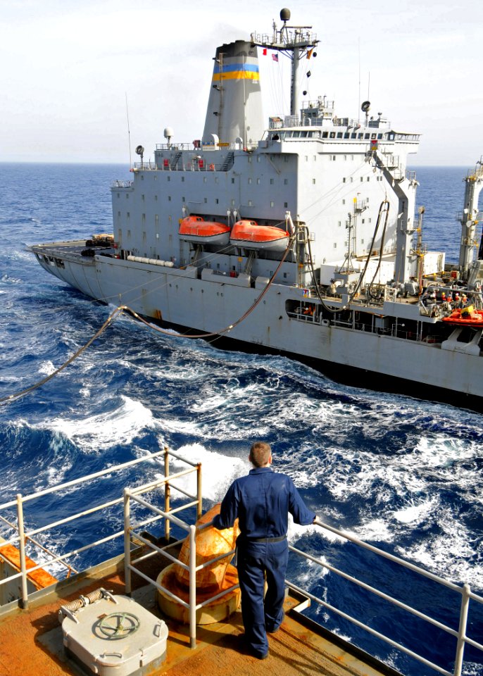 US Navy 100223-N-1082Z-071 Religious Programs Specialist Seaman Michael A. Papineau observes the refueling lines from USS Ashland (LSD 48) during a replenishment at sea
