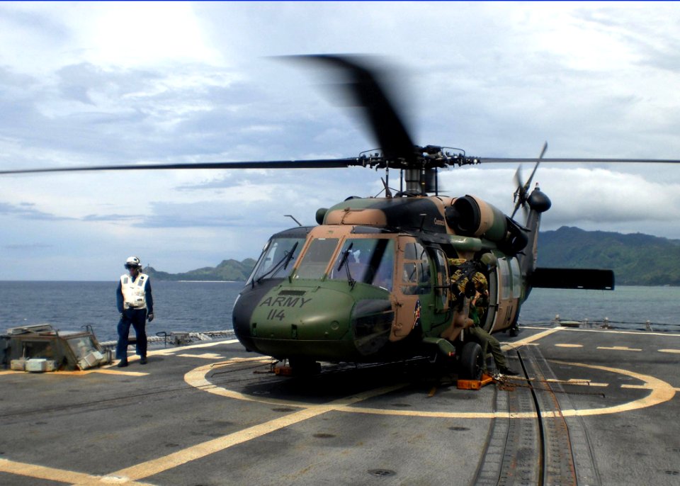 US Navy 100225-N-0000N-002 Australian International Security Force pilots conduct deck-landing qualifications aboard the guided-missile frigate USS Reuben James (FFG 57)