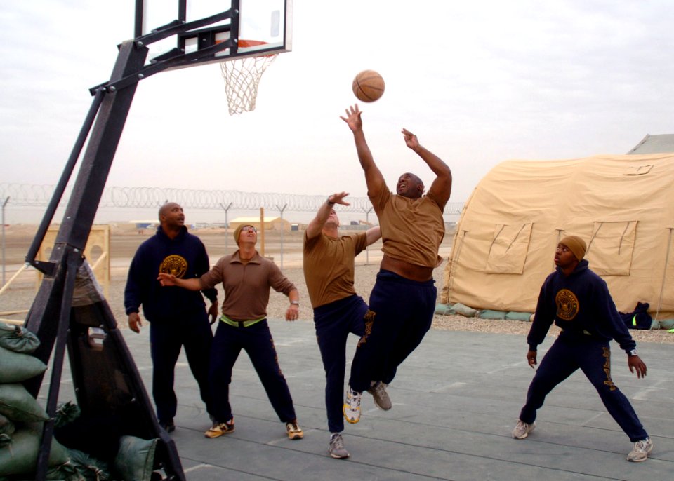 US Navy 100227-N-9564W-030 Equipment Operator 1st Class Gregory Shavers takes a shot during a Krutke Olympics basketball game