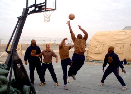 US Navy 100227-N-9564W-030 Equipment Operator 1st Class Gregory Shavers takes a shot during a Krutke Olympics basketball game