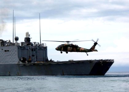 US Navy 100225-N-0000N-004 Australian International Security Force pilots conduct deck-landing qualifications aboard the guided-missile frigate USS Reuben James (FFG 57)