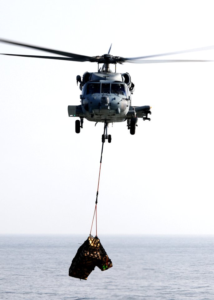 US Navy 100225-N-4236E-153 An HH-60H Sea Hawk helicopter assigned to the Nightdippers of Helicopter Anti-Submarine Squadron (HS) 5 performs a vertical replenishment