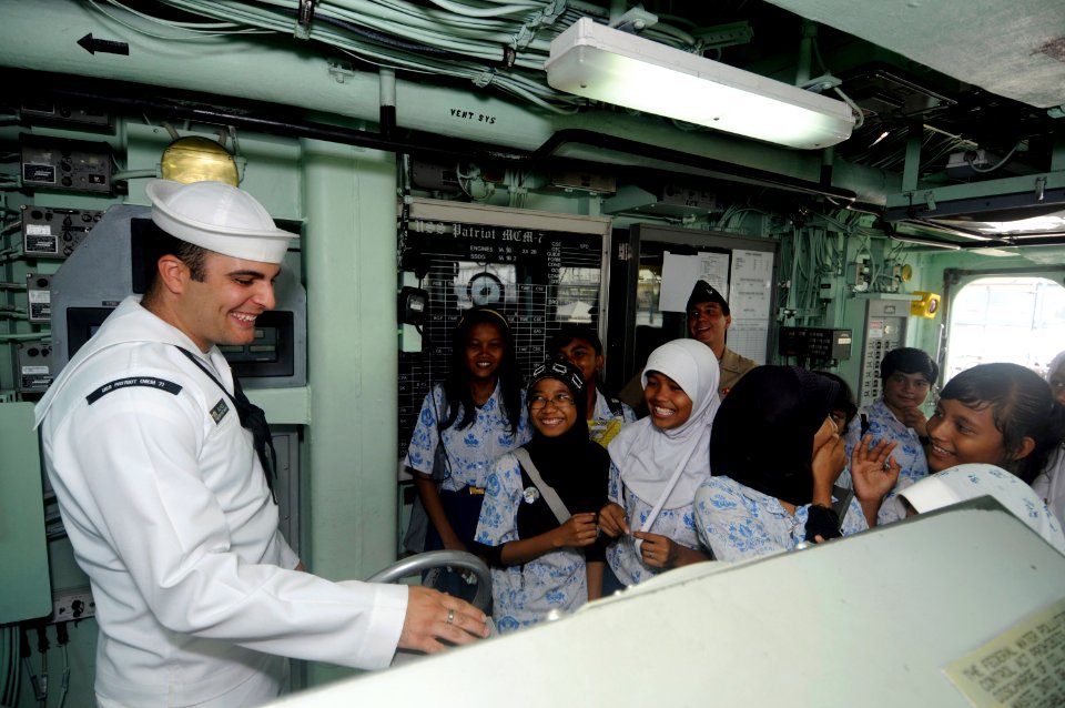 US Navy 100225-N-8335D-352 Mineman 2nd Class Zachary Sund gives a tour of the bridge of the mine counter-measures ship USS Patriot (MCM 7)