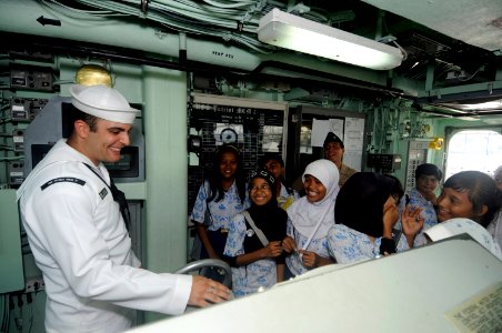 US Navy 100225-N-8335D-352 Mineman 2nd Class Zachary Sund gives a tour of the bridge of the mine counter-measures ship USS Patriot (MCM 7)