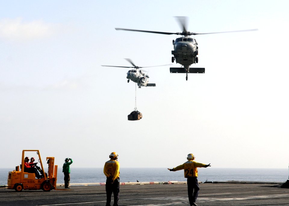 US Navy 100225-N-4236E-212 An HH-60H Sea Hawk helicopter assigned to the Nightdippers of Helicopter Anti-Submarine Squadron (HS) 5 and an MH-60S Sea Hawk helicopter assigned to the Chargers of Helicopter Sea Combat Squadron (HS