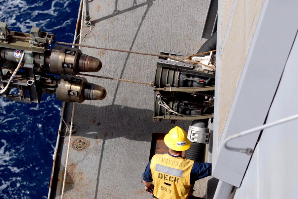 US Navy 100228-N-3358S-125 A Sailor aboard the amphibious transport dock ship USS Mesa Verde (LPD 19) monitors the incoming fuel lines from the Military Sealift Command dry cargo and ammunition ship USNS Robert E. Peary (T-AKE