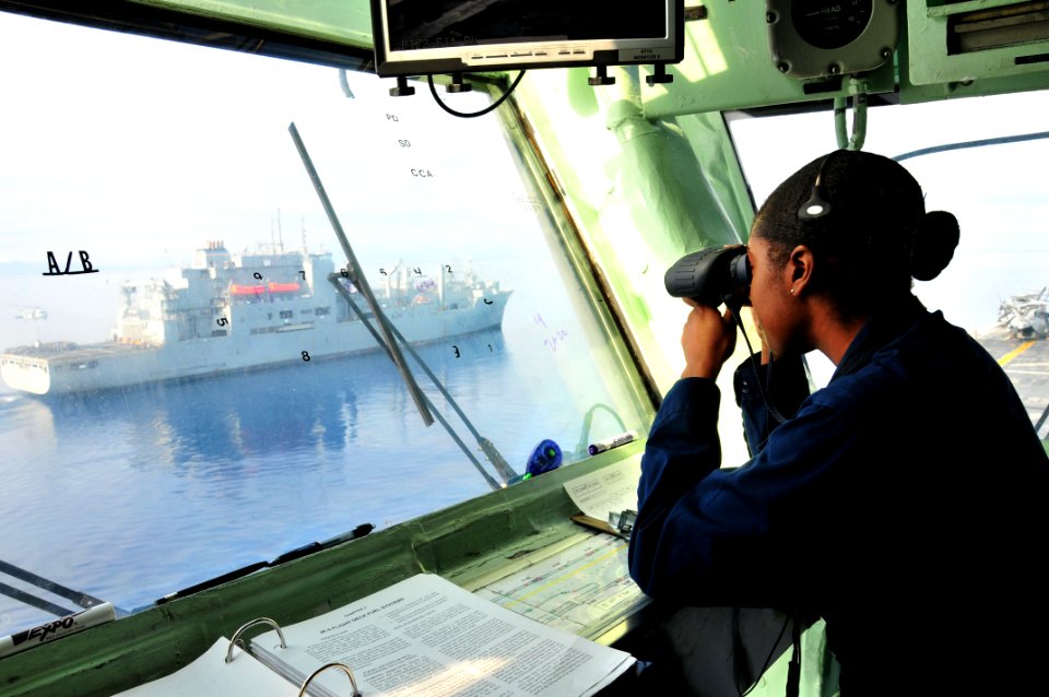US Navy 100228-N-9740S-300 Aviation Boatswain's Mate (Fuels) Airman Brandy Phillips, stands watch in primary flight control aboard the multi-purpose amphibious assault ship USS Bataan (LHD 5)