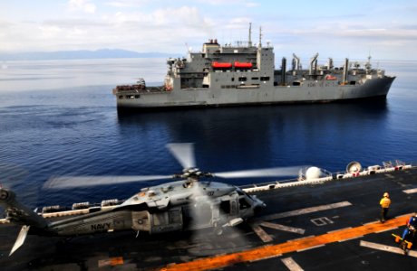 US Navy 100228-N-9740S-031 The Military Sealift Command dry cargo and ammunition ship USNS Sacagawea (T-AKE 2) transits alongside the multi-purpose