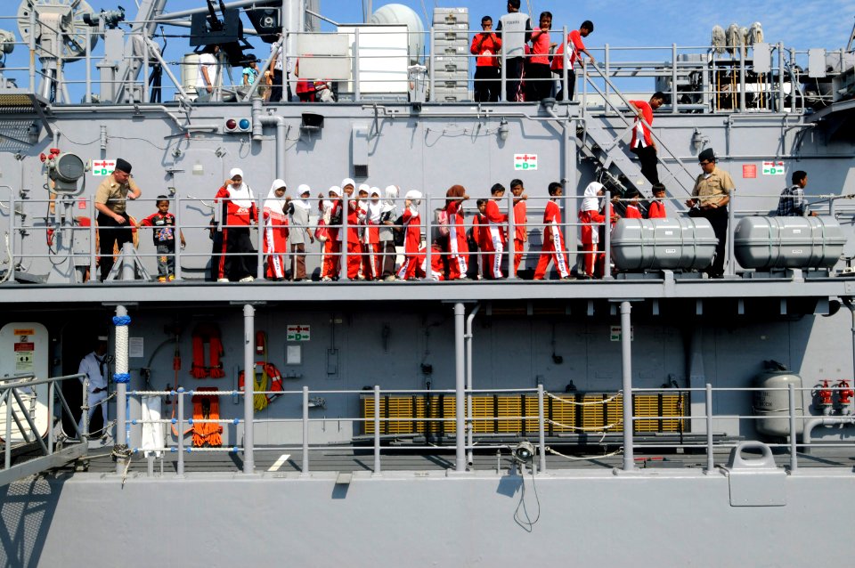 US Navy 100225-N-8335D-406 Children from an orphanage in Batam, Indonesia tour the mine counter-measures ship USS Patriot (MCM 7)