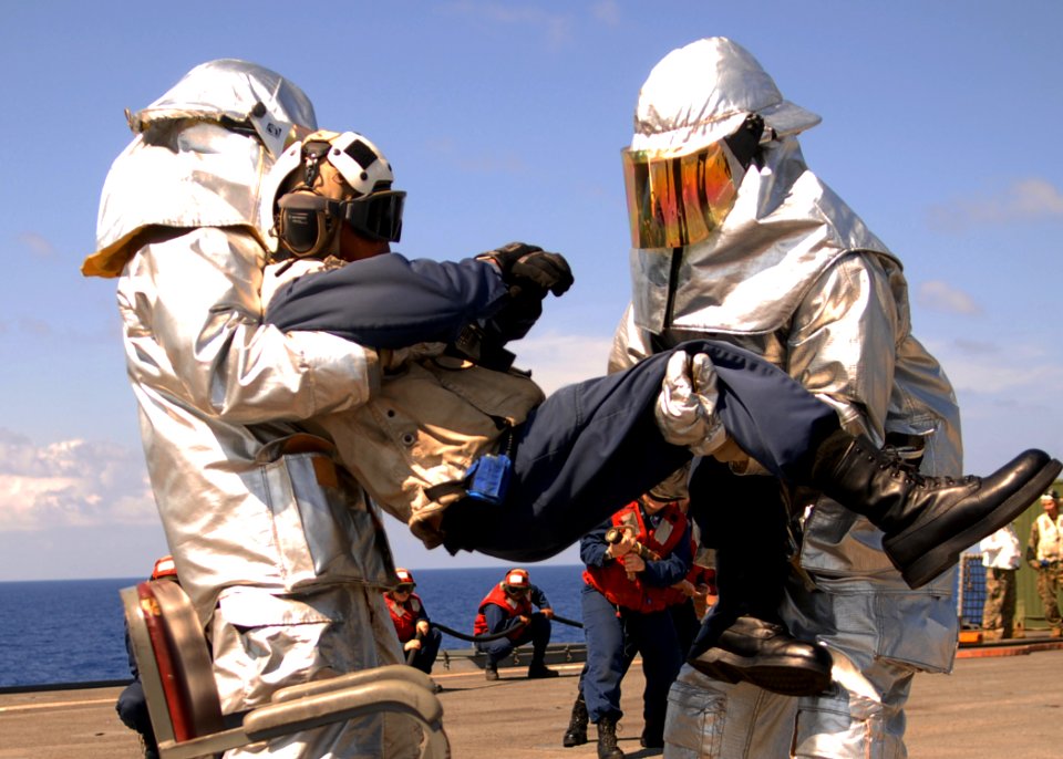 US Navy 100301-N-6692A-013 Sailors participate in a crash and smash drill aboard the amphibious dock landing ship USS Harpers Ferry (LSD 49)
