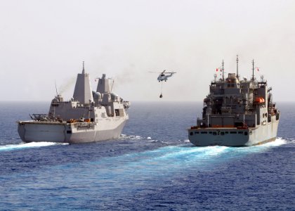 US Navy 100228-N-1082Z-017 The amphibious transport dock ship USS Mesa Verde (LPD 19) prepares to receive pallets of supplies from the Military Sealift Command dry cargo and ammunition ship USNS Robert E. Peary (T-AKE 5)