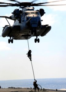 US Navy 100228-N-0120A-219 Marines assigned to the 31st Marine Expeditionary Unit (31st MEU), embarked aboard the forward-deployed amphibious assault ship USS Essex (LHD 2), rappel from a CH-53E Sea Stallion helicopter photo