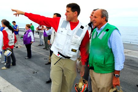 US Navy 100302-N-2953W-593 Cmdr. Putnam H. Browne, executive officer of the aircraft carrier USS Carl Vinson (CVN 70), explains flight operations to a Brazilian visitor before a flight demonstration