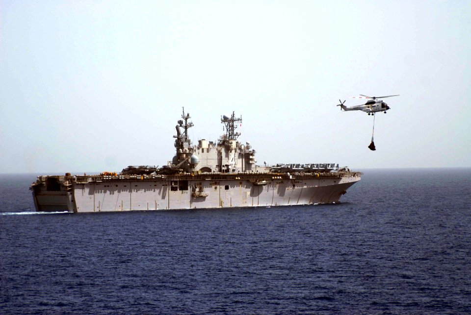 US Navy 100228-N-3358S-063 The amphibious assault ship USS Nassau (LHA 4) conducts a vertical replenishment with the Military Sealift Command dry cargo and ammunition ship USNS Robert E. Peary (T-AKE 5)