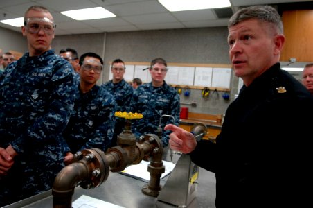 US Navy 100302-N-9818V-240 Master Chief Petty Officer of the Navy (MCPON) Rick West stops and talks to Sailors during a class at the Center for Naval Engineering during his visit to Naval Station Great Lakes
