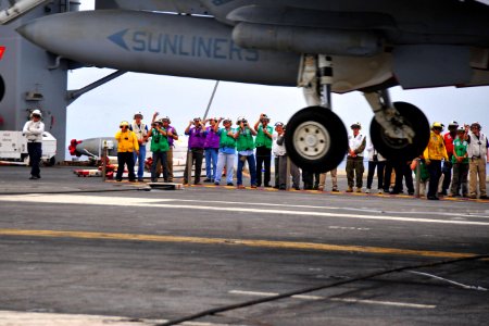 US Navy 100303-N-2953W-873 Brazilian visitors photograph an F-A-18 Super Hornet landing on the flight deck of the nuclear-powered aircraft carrier USS Carl Vinson (CVN 70). Carl Vinson is underway supporting Southern Seas 2010