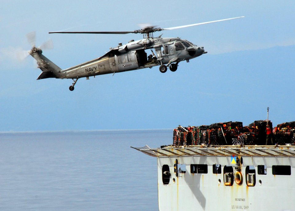 US Navy 100228-N-1092P-101 n MH-60S Sea Hawk helicopter from Helicopter Sea Combat Squadron (HSC) 22 prepares to move supplies from the Military Sealift Command dry cargo and ammunition ship USNS Sacagawea (T-AKE 2)