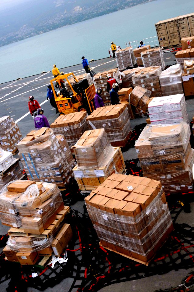 US Navy 100301-N-6410J-242 Sailors work together to safely store supplies aboard USNS Comfort (T-AH 20)