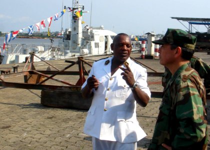 US Navy 100302-N-6138K-262 Vice Adm. Harry B. Harris Jr., right, commander of U.S. 6th Fleet, tours Cameroon navy facilities in the southwest province of Cameroon