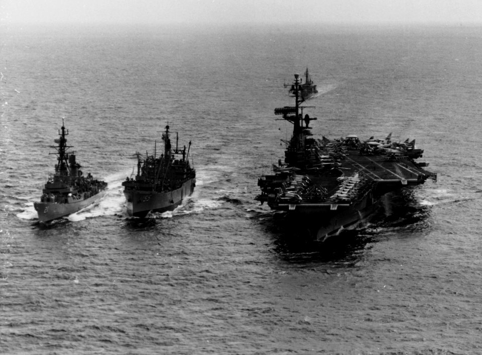 USS Aludra (AF-55) replenishes USS Coral Sea (CVA-43) and USS Cochrane (DDG-21) off Vietnam on 15 May 1965 (NH 104027)