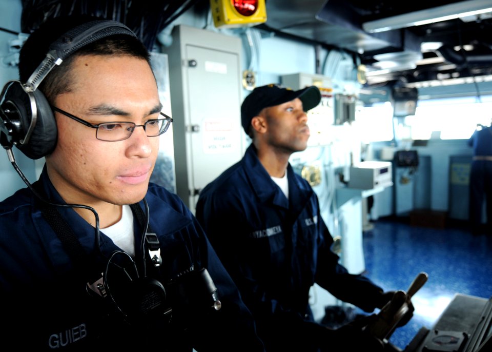 US Navy 100301-N-7908T-120 Seaman Rhuttie S. Guieb, assigned to the deck department of the Nimitz-class aircraft carrier USS George H.W. Bush (CVN 77), takes the lee helm on the ship's bridge