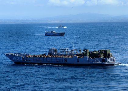 US Navy 100302-N-7948R-827 Marines assigned to the 15th Marine Expeditionary Unit (15th MEU) ride in Landing Craft Unit (LCU) 1630 after leaving the amphibious assault ship USS Peleliu (LHA 5)