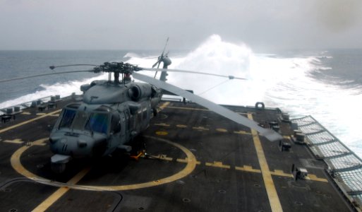 US Navy 100303-N-7058E-134 A rooster tail forms in the wake of the littoral combat ship USS Freedom (LCS 1) during high-speed operations in the Caribbean Sea