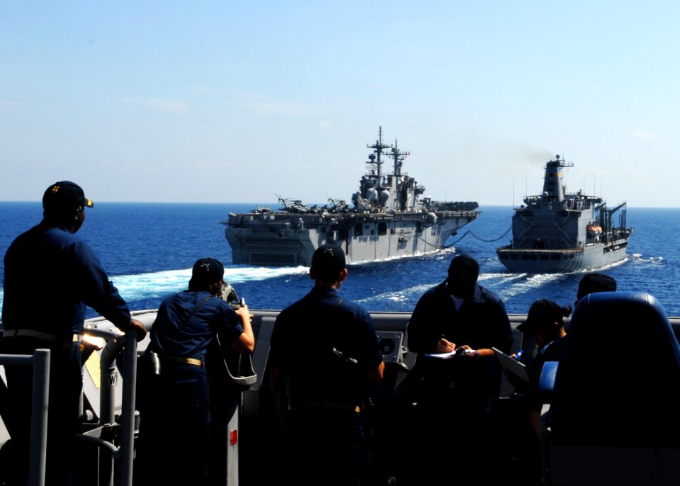 US Navy 100302-N-6692A-034 Sailors aboard the amphibious dock landing ship USS Harpers Ferry (LSD 49) stand watch at the port bridge wing