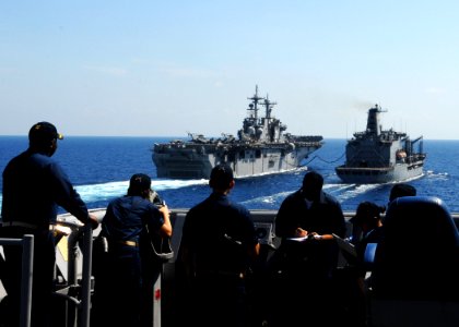 US Navy 100302-N-6692A-034 Sailors aboard the amphibious dock landing ship USS Harpers Ferry (LSD 49) stand watch at the port bridge wing