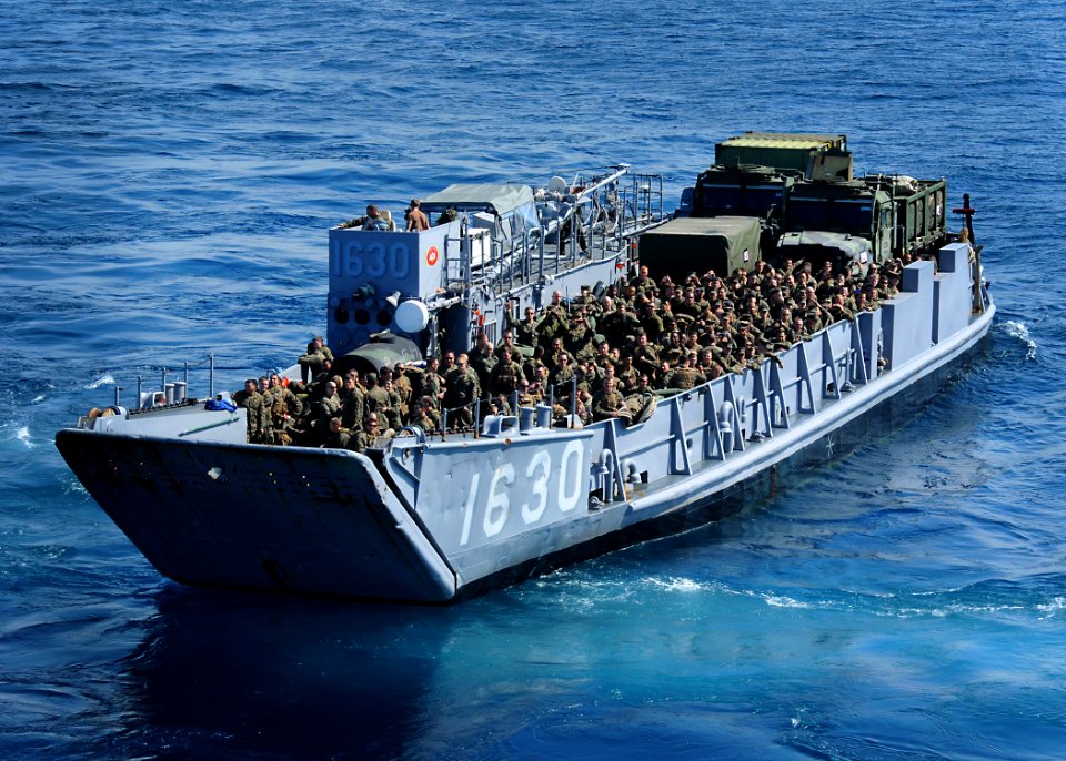 US Navy 100302-N-7948R-779 Marines assigned to the 15th Marine Expeditionary Unit (15th MEU) ride in Landing Craft Unit (LCU) 1630 after leaving the amphibious assault ship USS Peleliu (LHA 5)