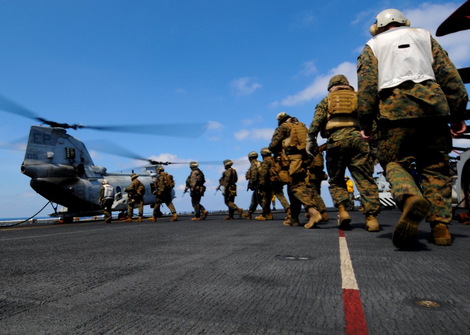 US Navy 100228-N-9950J-589 Marines assigned to the 31st Marine Expeditionary Unit (31st MEU) board a CH-46E Sea Knight helicopter before fast rope training aboard the forward-deployed amphibious assault ship USS Essex (LHD 2)