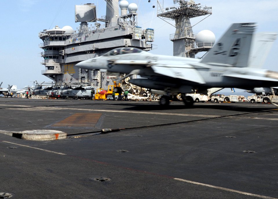 US Navy 100304-N-4236E-063 An FA-18F Super Hornet assigned to the Jolly Rogers of Strike Fighter Squadron (VFA) 103 catches the arresting wire on the flight deck of the Nimitz-class aircraft carrier USS Dwight D. Eisenhower (CV