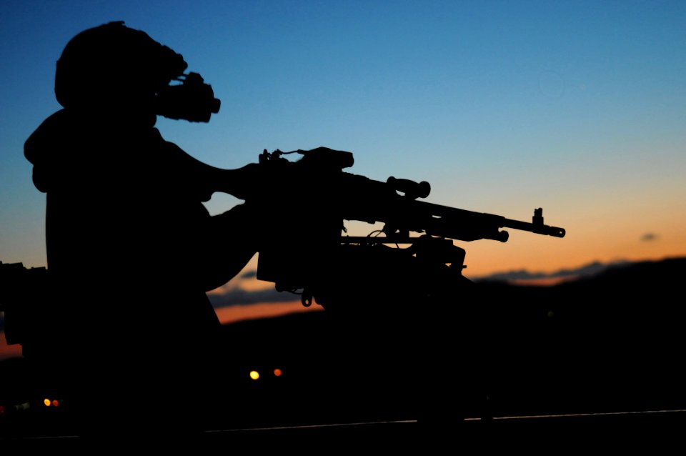 US Navy 100304-N-4420S-208 A crewman qualification training instructor tests his night vision equipment before conducting night weapons training on a remote range at Camp Pendleton