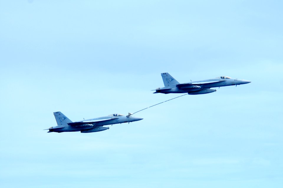 US Navy 100303-N-0808V-185 F-A-18 Super Hornets demonstrate an aerial refueling as part of an air demonstration for Brazilian guests aboard the aircraft carrier USS Carl Vinson (CVN 70)