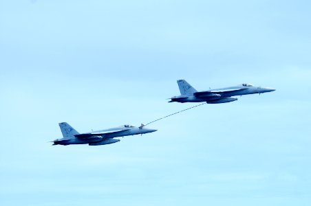 US Navy 100303-N-0808V-185 F-A-18 Super Hornets demonstrate an aerial refueling as part of an air demonstration for Brazilian guests aboard the aircraft carrier USS Carl Vinson (CVN 70)