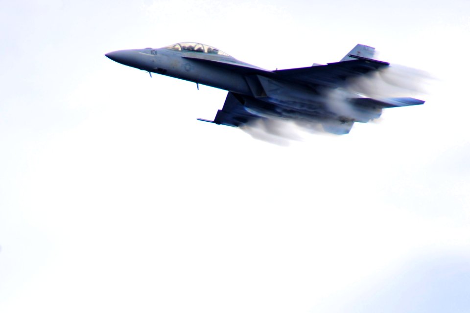 US Navy 100303-N-2953W-567 An F-A-18 Super Hornet performs maneuvers during a flight demonstration aboard the aircraft carrier USS Carl Vinson (CVN 70)