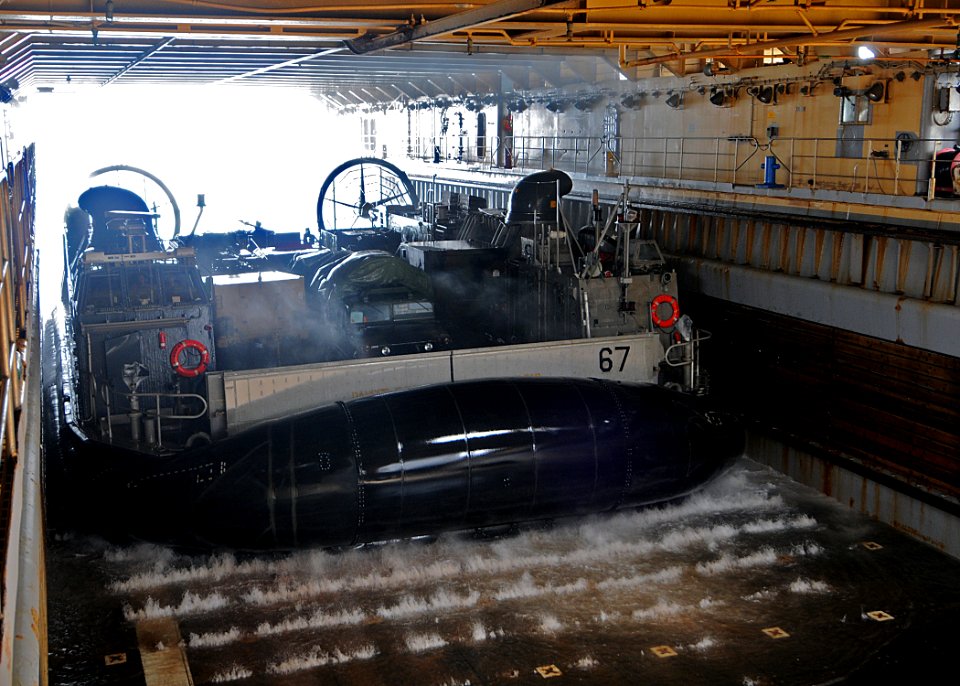 US Navy 100305-N-1082Z-035 Landing Craft Air Cushion (LCAC) 67, assigned to Assault Craft Unit (ACU) 4, enters the well deck of the amphibious dock landing ship USS Ashland (LSD 48)
