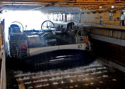 US Navy 100305-N-1082Z-035 Landing Craft Air Cushion (LCAC) 67, assigned to Assault Craft Unit (ACU) 4, enters the well deck of the amphibious dock landing ship USS Ashland (LSD 48)
