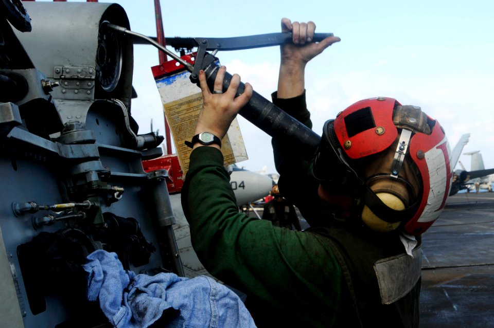 US Navy 100303-N-3038W-872 Aviation Machinist's Mate 3rd Class Kristina Frye performs maintenance on an SH-60F Sea Hawk helicopter