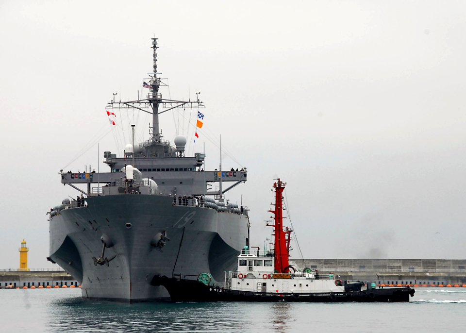 US Navy 100305-N-9573A-005 A tug boat guides the U.S. 7th Fleet command ship USS Blue Ridge (LCC 19) as it arrives in Busan, Republic of Korea