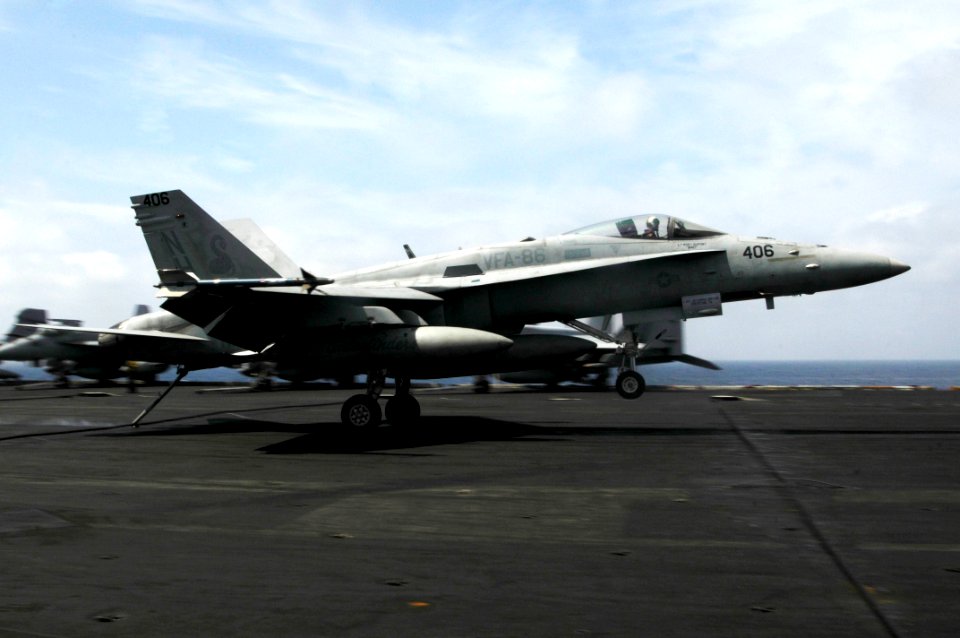 US Navy 100303-N-3038W-372 An F-A-18C Hornet assigned to the Sidewinders of Strike Fighter Squadron (VFA) 86 lands aboard the aircraft carrier USS Nimitz (CVN 68)