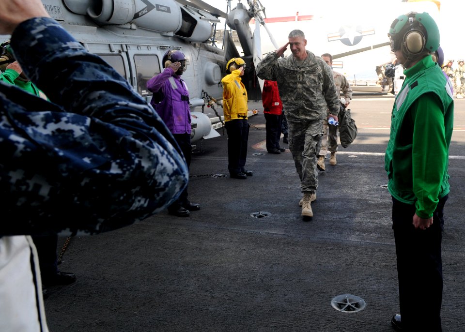 US Navy 100304-N-4236E-120 Lt. Gen. David M. Rodriguez, commander of International Security Assistance Force Joint Command, walks through side boys as he arrives on the Nimitz-class aircraft carrier USS Dwight D. Eisenhower (CV