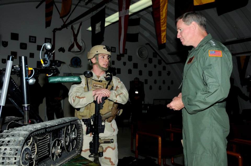 US Navy 100304-N-1906L-004 Adm. Patrick Walsh, right, commander of U.S. Pacific Fleet, listens to a brief by Explosive Ordnance Disposal Technician 1st Class Ryan Gilfillan
